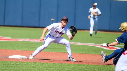 Jake Topolski readies to catch the ball and tag out the runner at second.