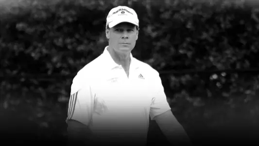 A black and white photo of former women's tennis head coach Mark Wesselink