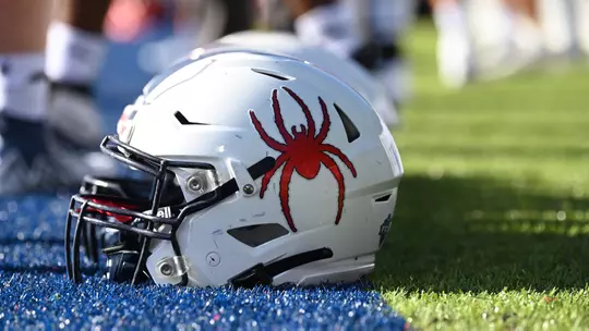 Football helmet on the turf at Robins Stadium