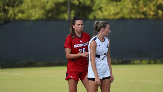 Brigit Bussiere against a defender