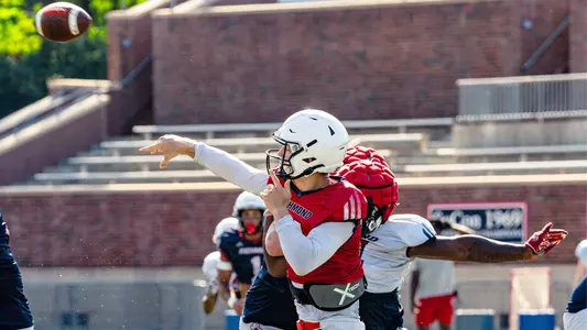 Cam Coleman completes a pass during Richmond football practice on Aug. 14, 2024