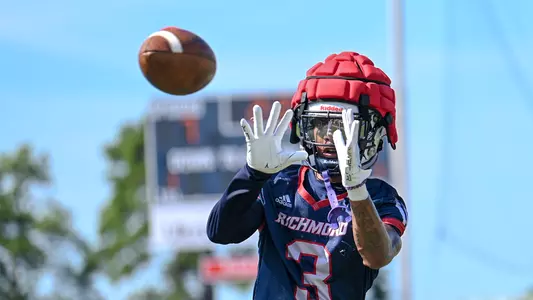 Quanye Veney makes a catch during Richmond's football practice on Aug. 2, 2024