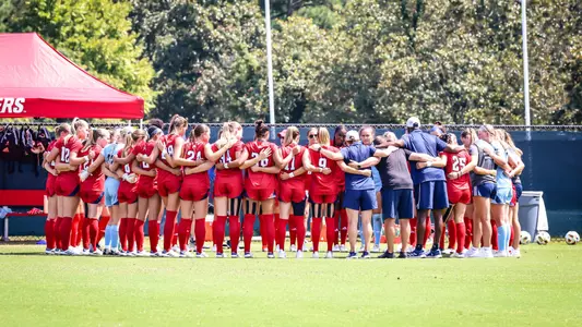 Women's Soccer in a pregame huddle