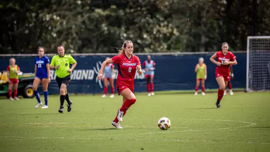 Kiley Fitzgerald dribbling the ball down the field