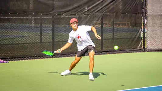 Sam Rathmanner returning a serve during practice