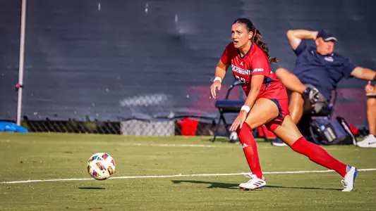 Grace Ferrara dribbling the ball during a home match