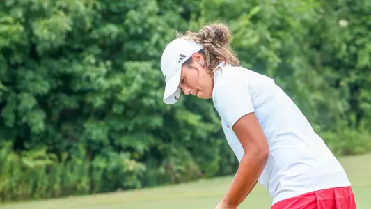Maya Beasley stares down her putt on the green