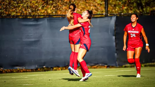 Kiley Fitzgerald and Brigitte Bussiere celebrating a goal