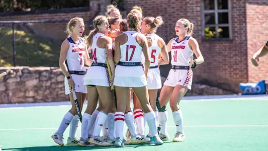 Spider Hockey in their all white uniforms celebrate overtime victory over Temple