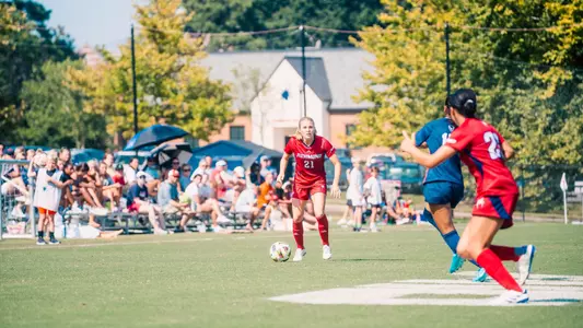 Photo of Gwen Howell about to send in a cross