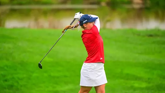 Caroline Thompson holds her follow through after her tee shot