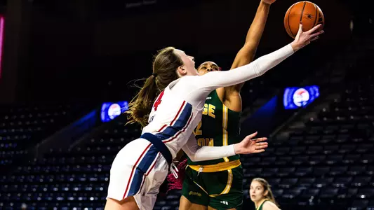 Maggie Doogan shooting a layup