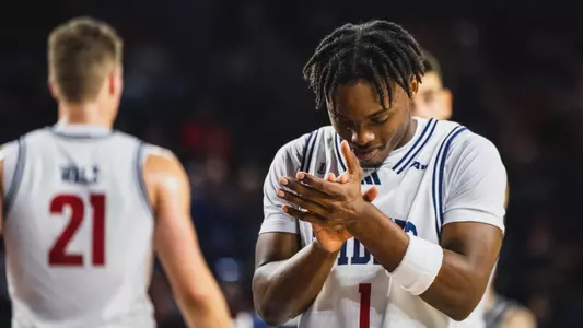 Mikkel Tyne claps his hands following a play