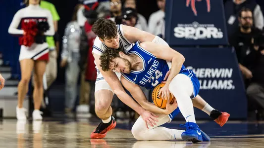 Jonathan Beagle and Gibson Jimerson battel for a loose ball