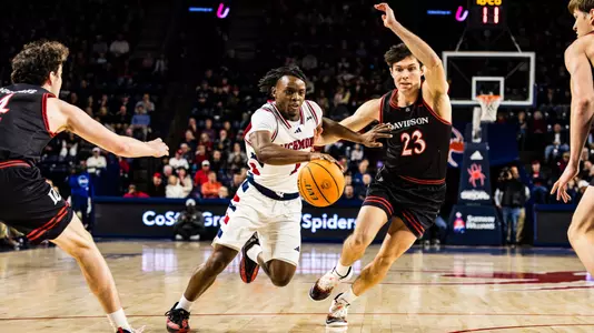 Mikkel Tyne drives to the basket vs Davidson