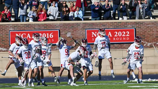Men's lacrosse celebrating a goal