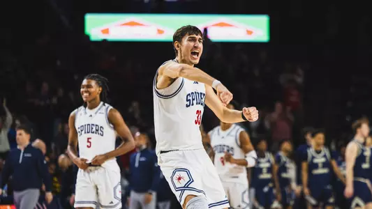 Apostolos Roumoglou celebrates with a fist pump vs George Washington