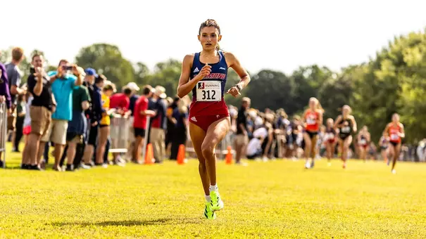 Hallie Muniz crossing finish line at 2025 Spider Alumni Open