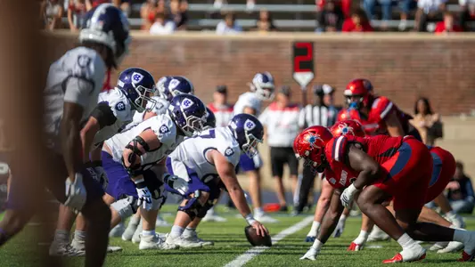 Richmond's linemen on the line of scrimmage going up against Holy Cross'