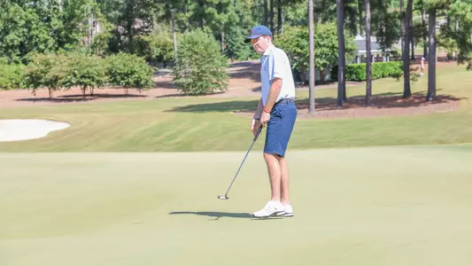 Quin Polin watches his putt travel towards the hole