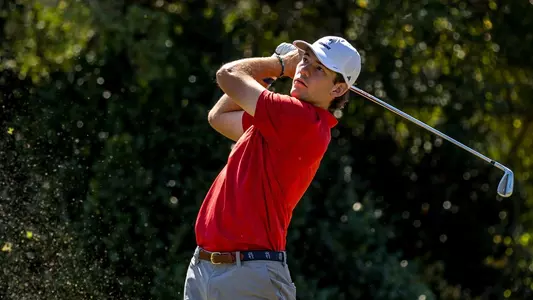 Lucas Rizo-Patron holds his follow-through on the tee box