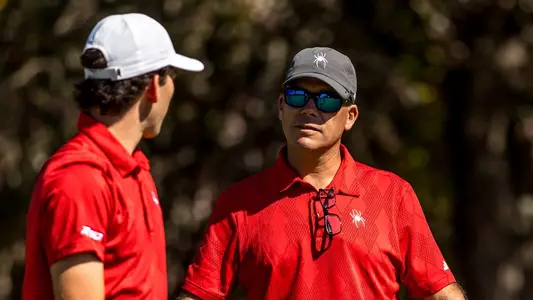 Coach Adam Decker stares at Lucas Rizo-Patron