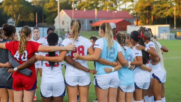 Women's Soccer huddled pregame