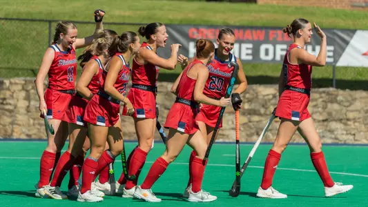 Spider field hockey celebrates Clara Larripa's goal against Saint Louis