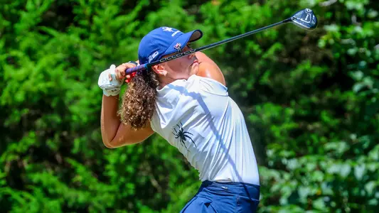 Hannah Lydic stares down her tee shot