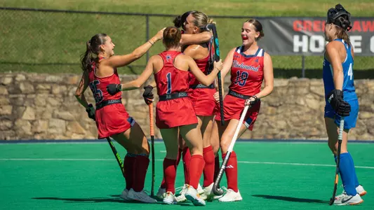 Spider field hockey celebrates Clara Larripa's goal