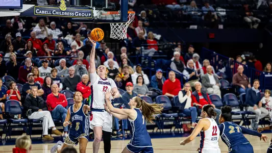 Sam Dewey shooting a layup