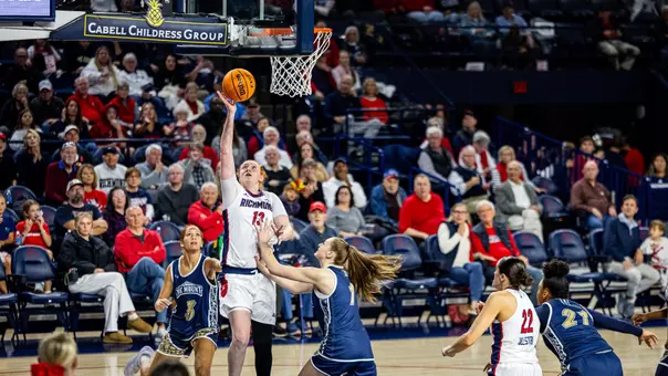 Sam Dewey shooting a layup