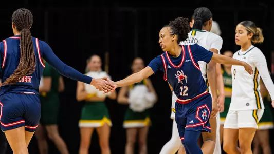 Aneisha Scott high fiving Rayne