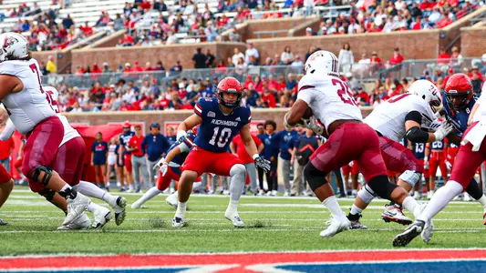 Carter Glassmyer prepares to take on a Leopard rusher during Richmond's game against Lafayette on Nov. 15, 2025