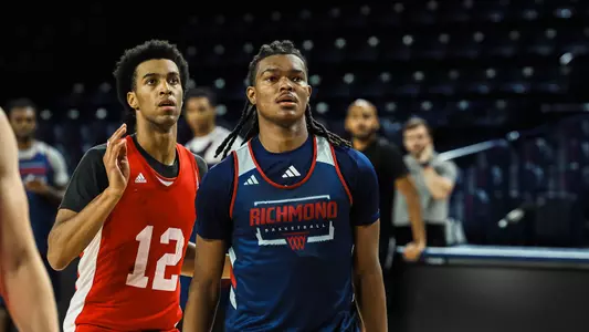 Collin Tanner turns to face the basket on defense