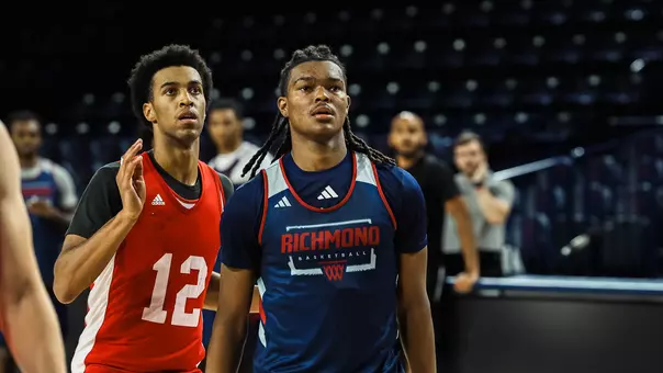 Collin Tanner turns to face the basket on defense