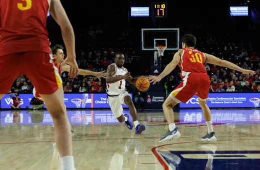 Mikkel Tyne drives through the VMI defense