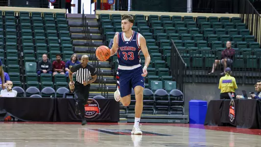 Apostolos Roumoglou dribbles upcourt vs Furman