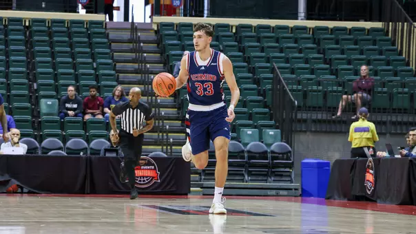 Apostolos Roumoglou dribbles upcourt vs Furman