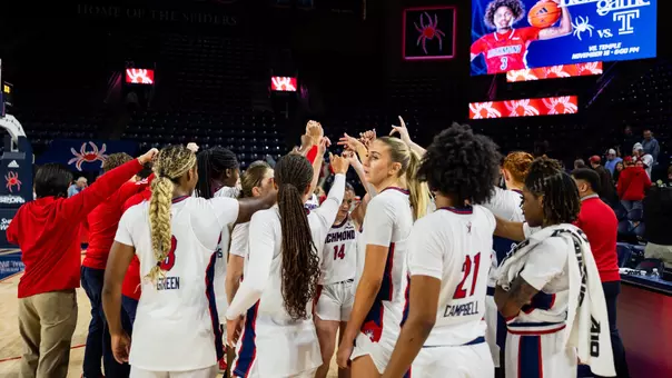 Basketball team huddled pregame