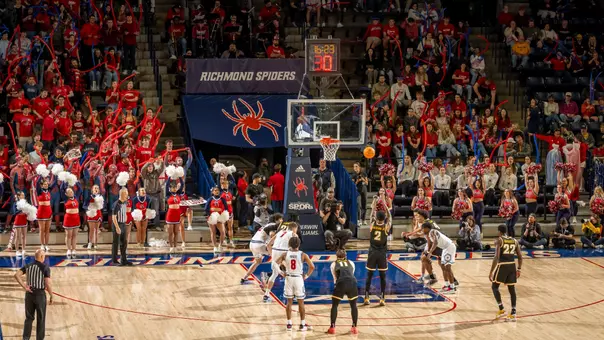 An opposing player shoots a free throw at the Robins Center