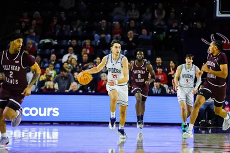 Apostolos Roumoglou dribbles the ball up court