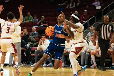 AJ Lopez is fouled while driving to the basket