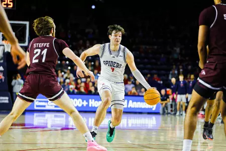 Jonathan Beagle dribbles at the top of the key
