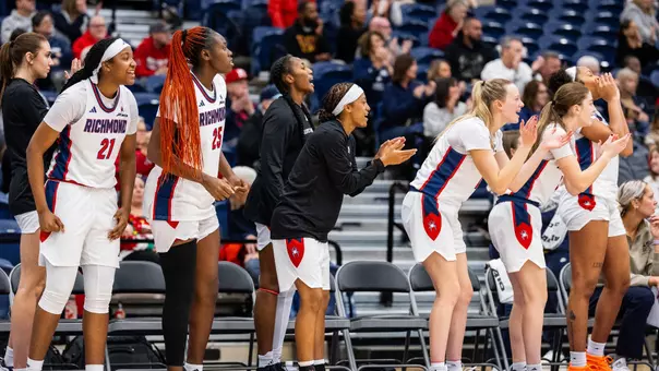 Spiders celebrating on the bench in Henrico