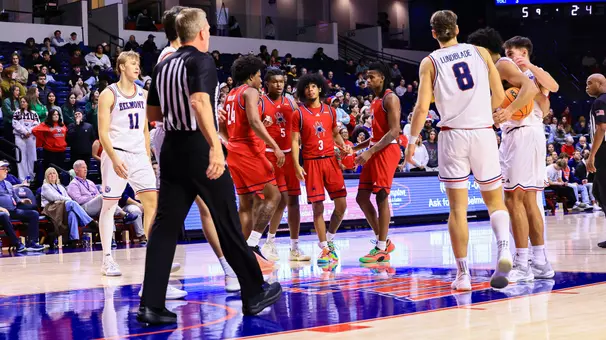 Aiden Argabright at the center of a huddle on the foul line