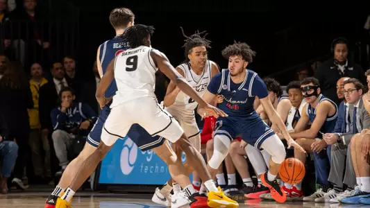 George Washington III dribbles at VCU