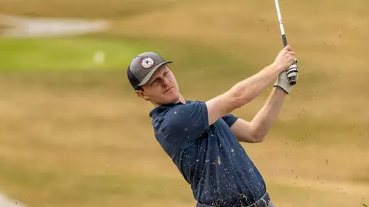 Cole Ekert holds his follow through on an approach shot