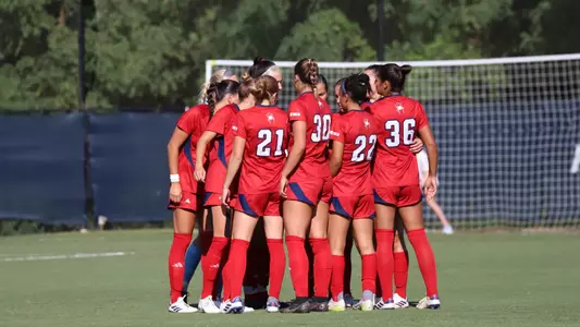 Women's Soccer in a huddle pregame