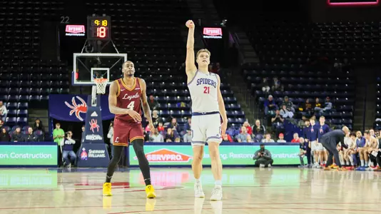 Mike Walz holds his follow through after a three-point attempt